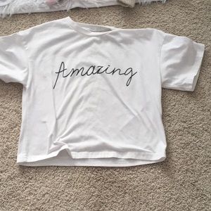 A crop top that says amazing on it